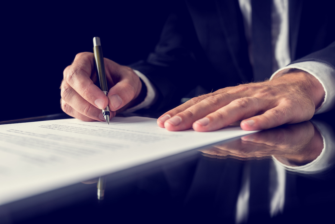 Person signing a contract