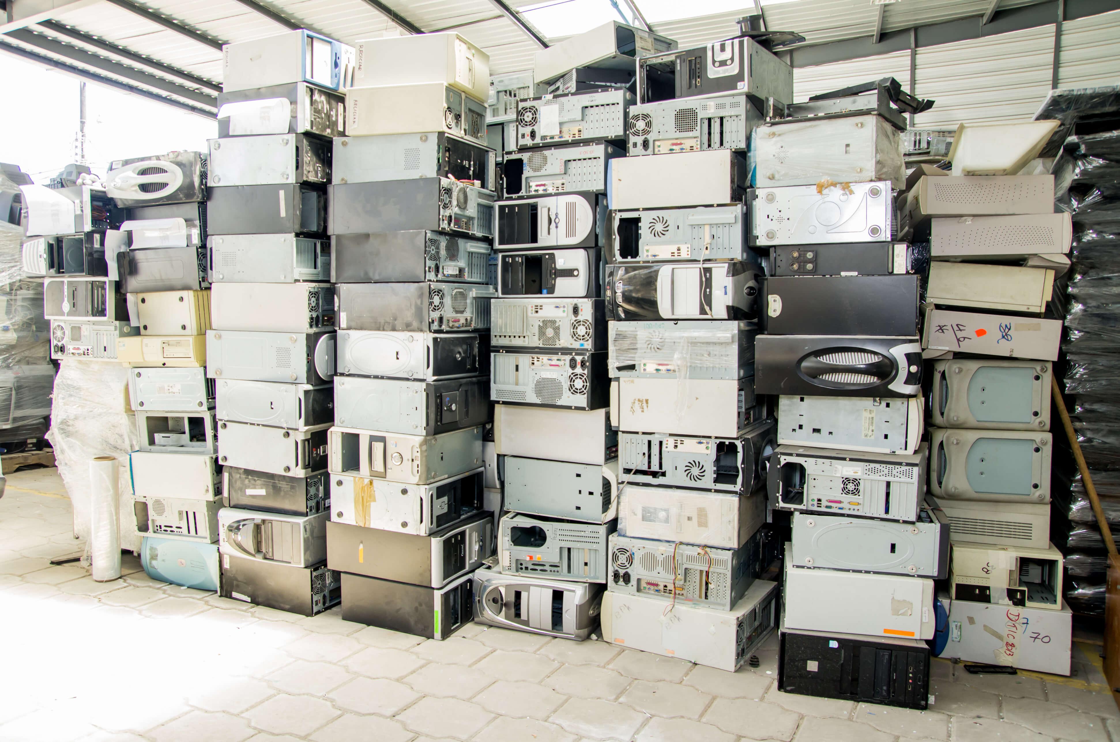 Old Computer Towers Piled to Ceiling